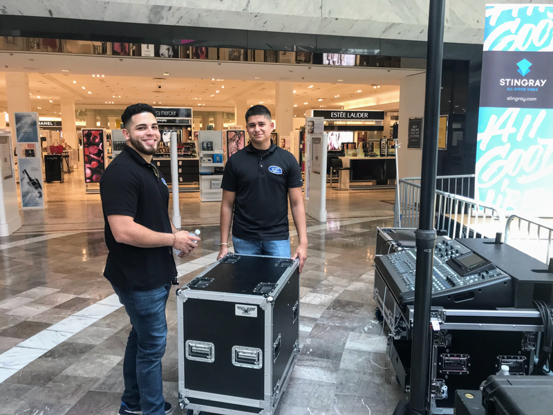 Professional AV crew setting up live sound equipment for NJ event