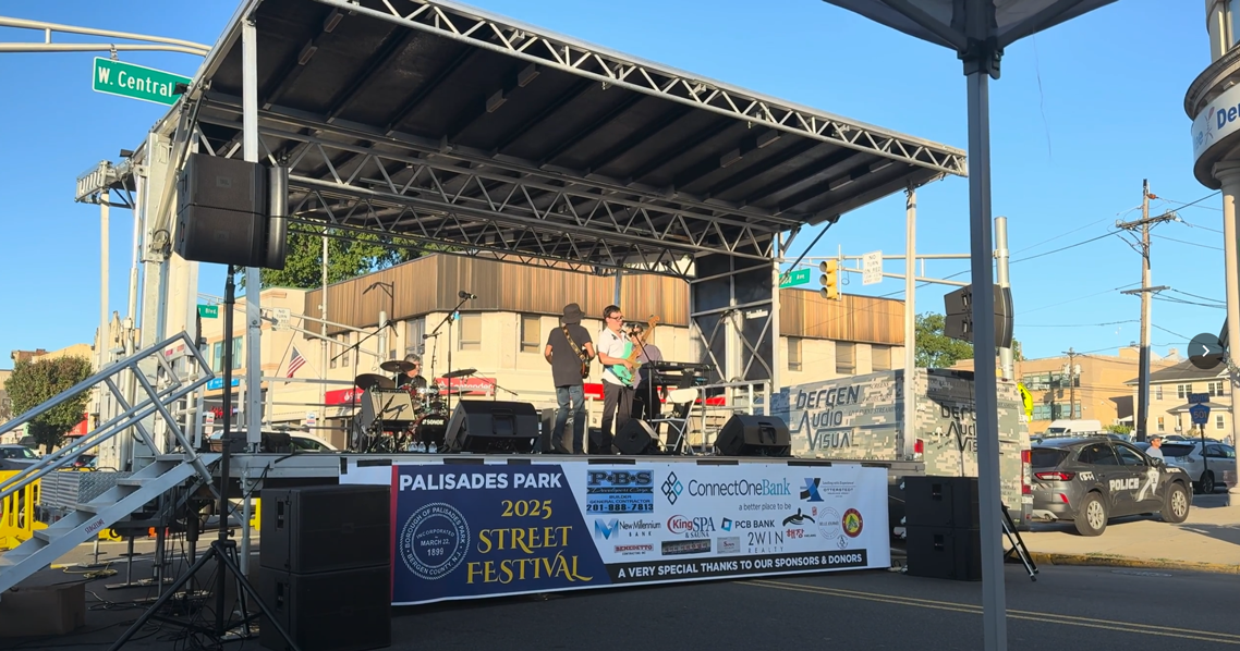 JBL VRX932LAP line array speakers on stands at outdoor street festival stage New Jersey